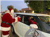 Santa and family in vehicle
