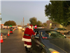 Santa greeting family car